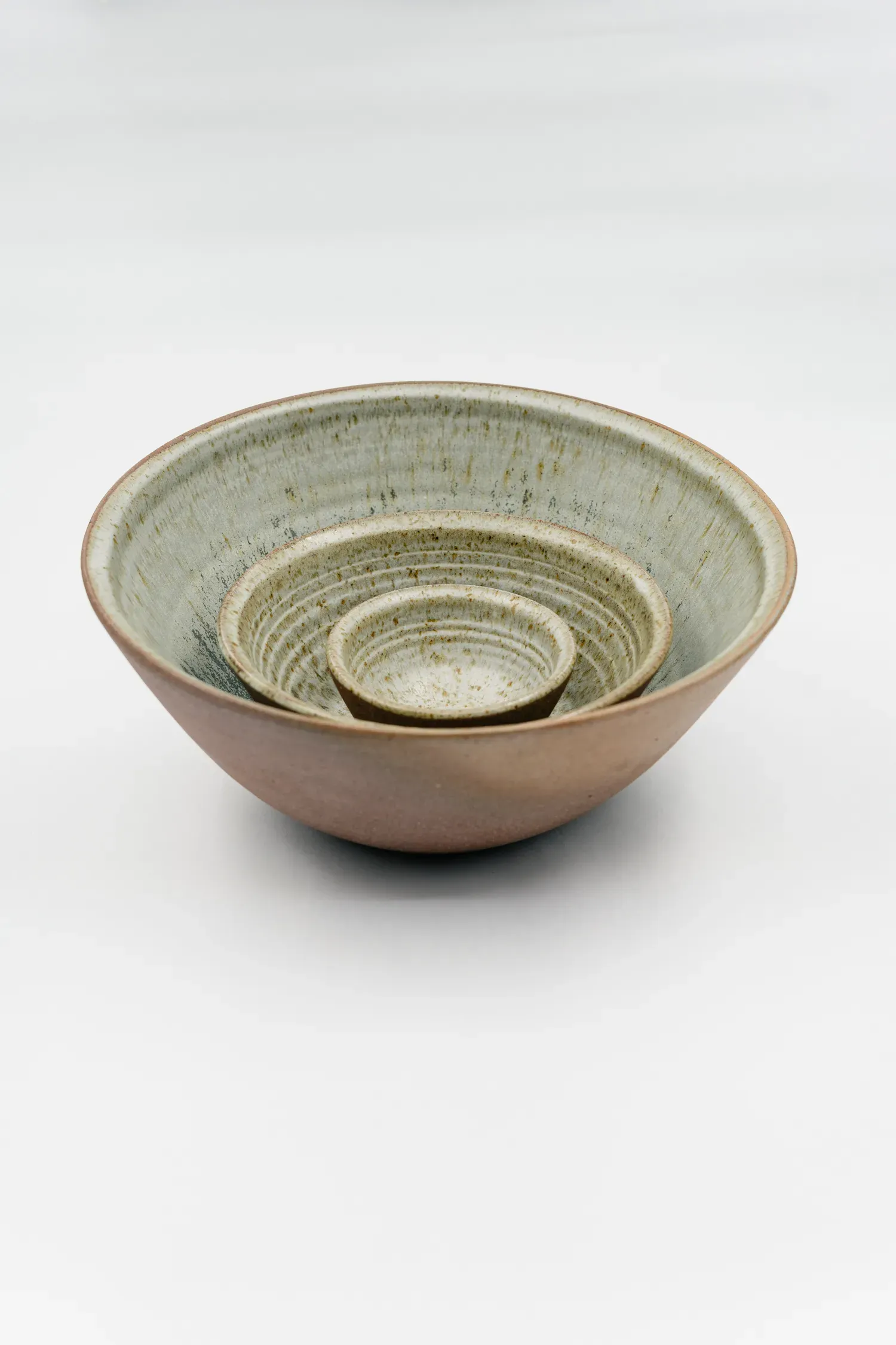 Wallpaper: "Broken Ceramic family, featuring three bowls (above) and three plates, made of Bali clay and a glaze made from powdered glass recycled from Potato Head"