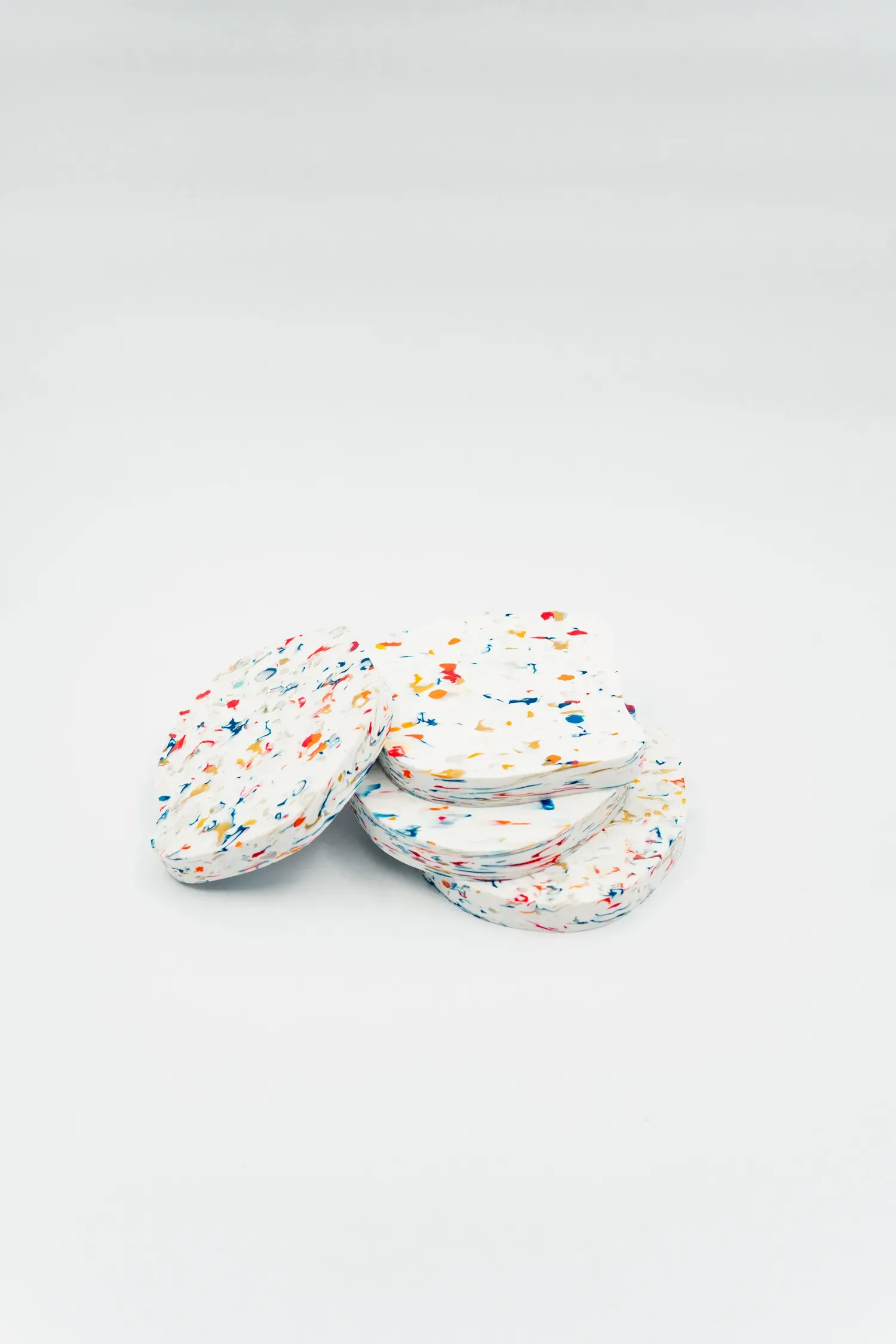 Wallpaper: "Coasters made of HDPE leftover from the chair pr"