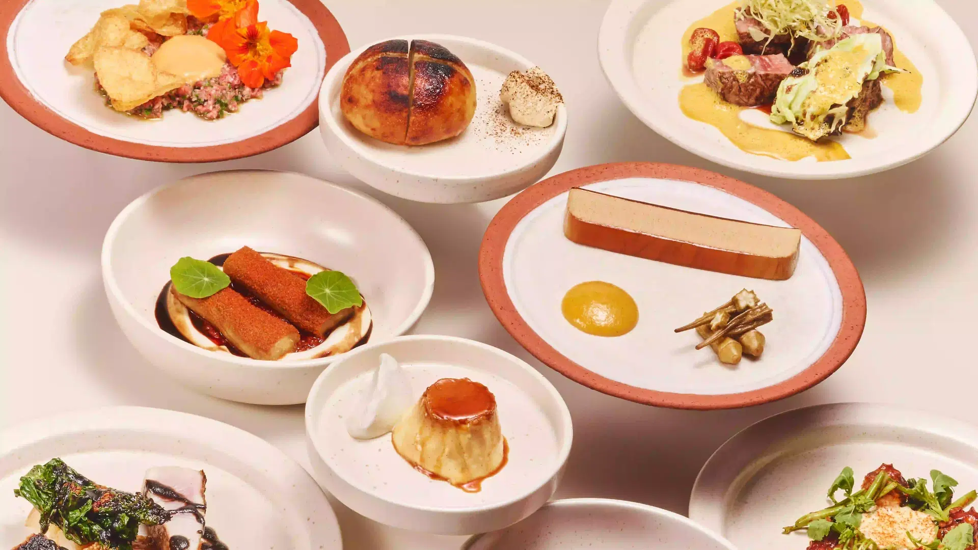Fine dining plates from Dome, a Bali dinner restaurant in Seminyak offering festive culinary experiences with wine pairing.