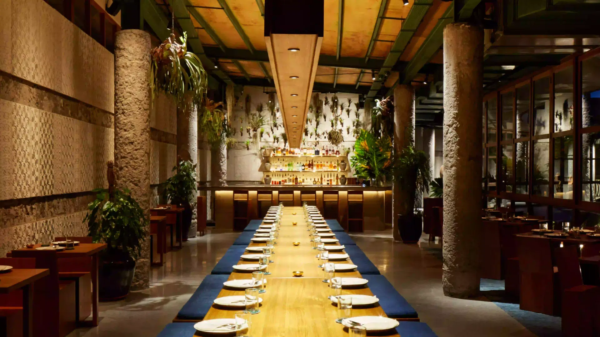 Kaum restaurant interior at Desa Potato Head Bali, Indonesian restaurant in Seminyak featuring long-table communal dining and festive ambience