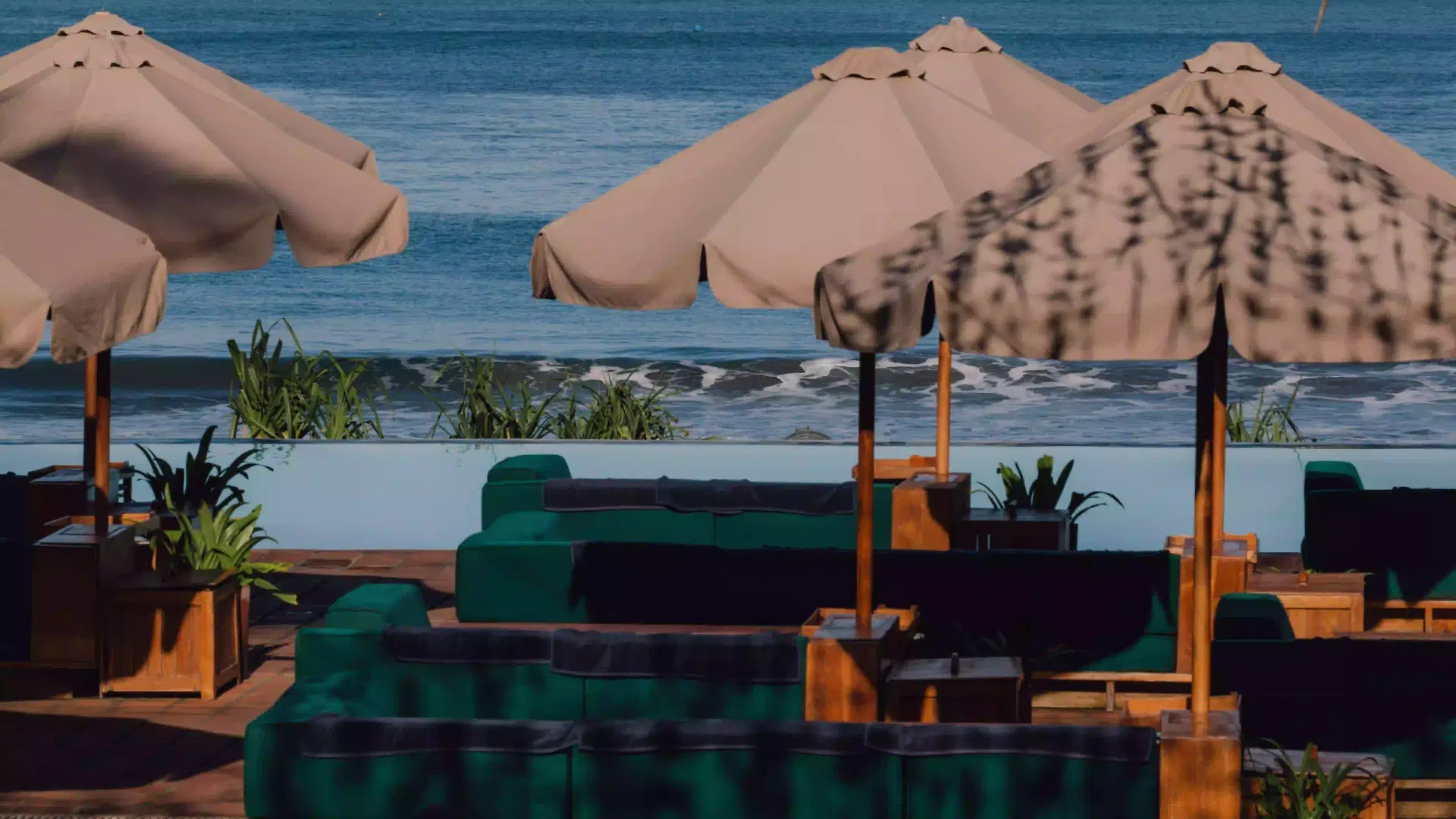 Beachfront seating at Potato Head Beach Club Bali, relaxed dining area by the ocean in Seminyak, perfect for festive evenings