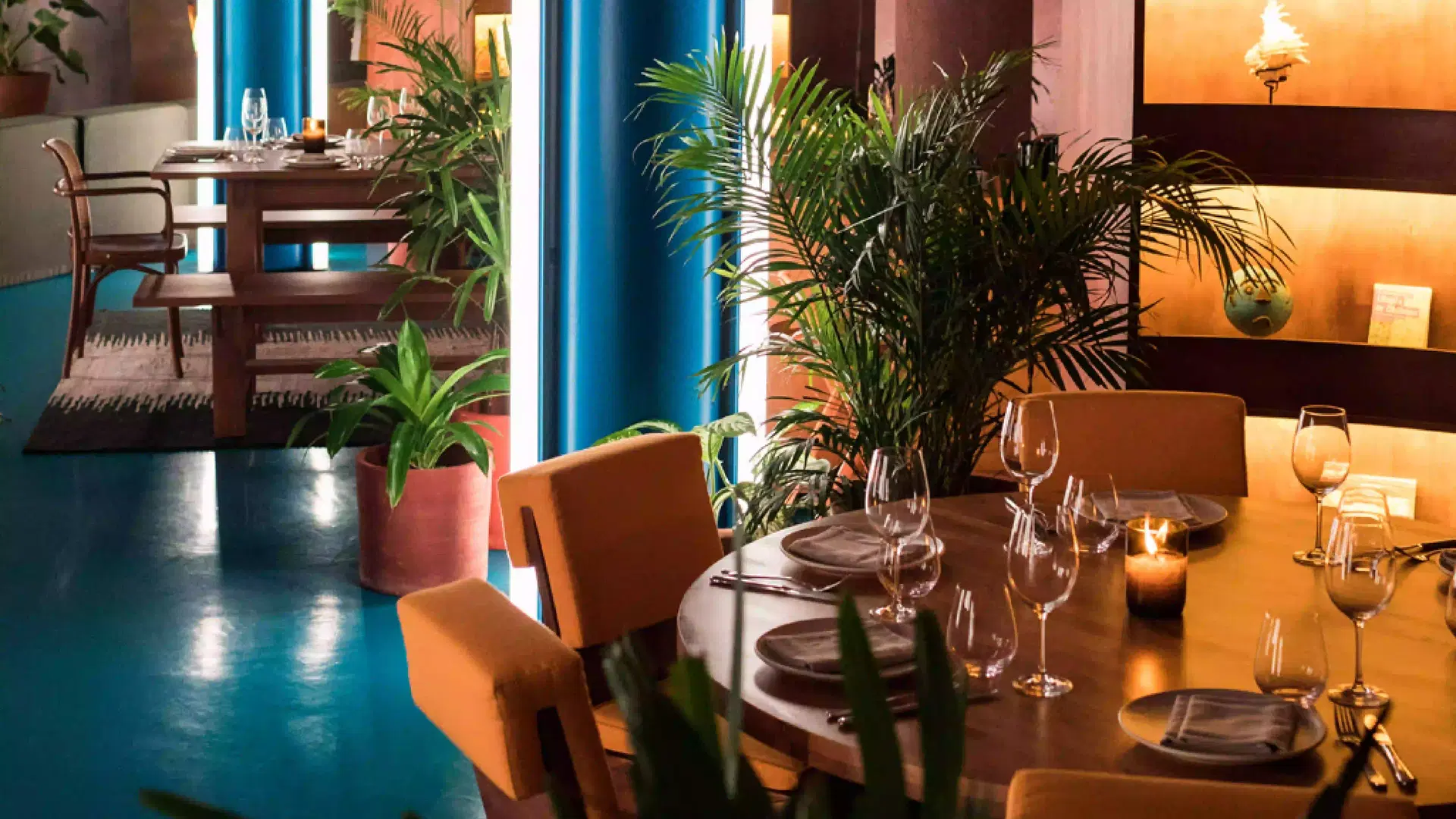 Cosy restaurant corner at Dome, Seminyak. Perfect for festive dinners and wine pairings at Desa Potato Head Bali